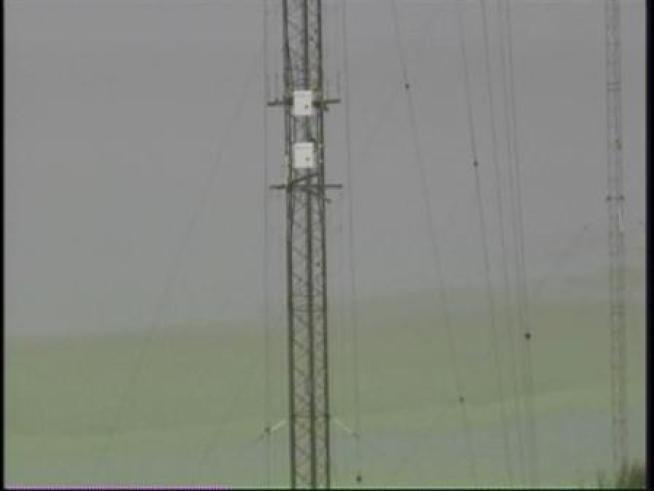 NTSB officials are trying to determine whether a radio tower's lights were on when a medical helicopter crashed into it, killing everyone onboard.