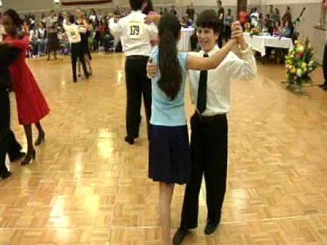 About 100 Chicago-area fifth-graders tripped the light fantastic in a ballroom dance competition Sunday night.
