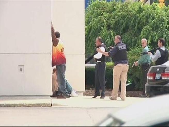 A bank is surrounded by Skokie police because employees suspect two men, but the men say they just wanted to open up a bank account and are released.