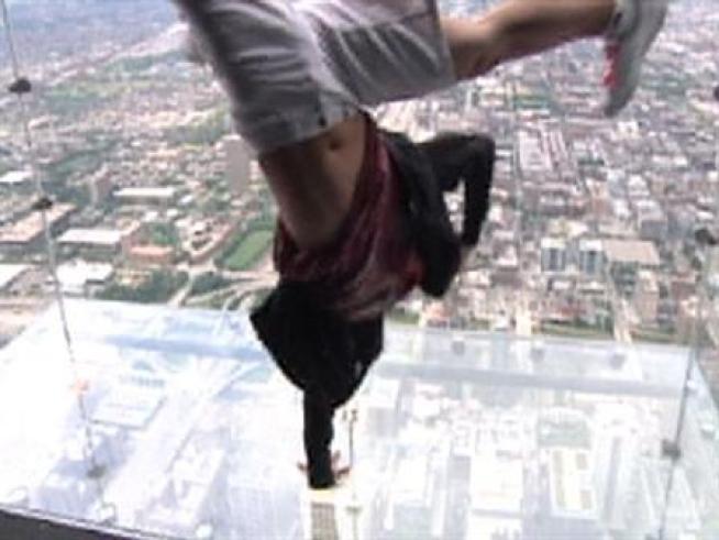 Some people won't even brave stepping out on the Ledge, but one guy clearly moves to the beat of his own drum.