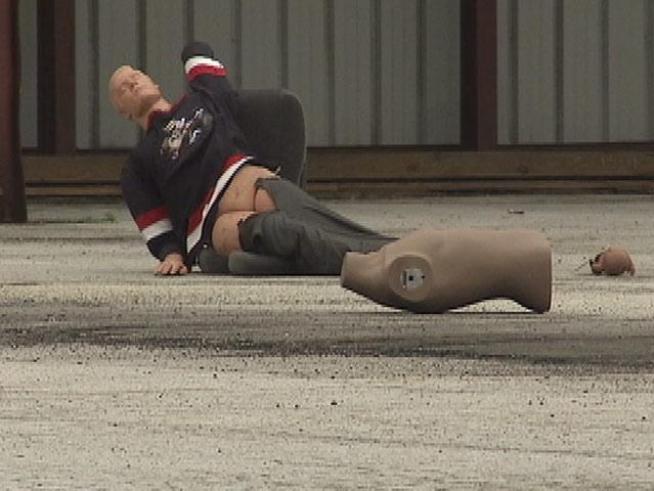 Mannequins simulate those who could die in an airline disaster over <a title=