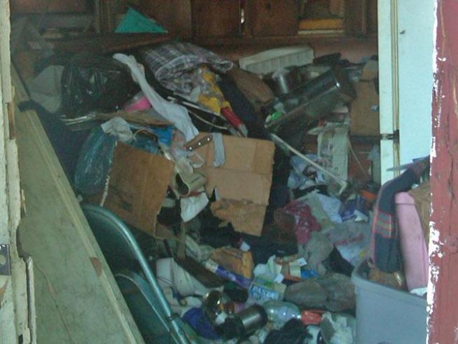 An elderly pair of South Siders were recently held hostage for weeks -- by their own trash.