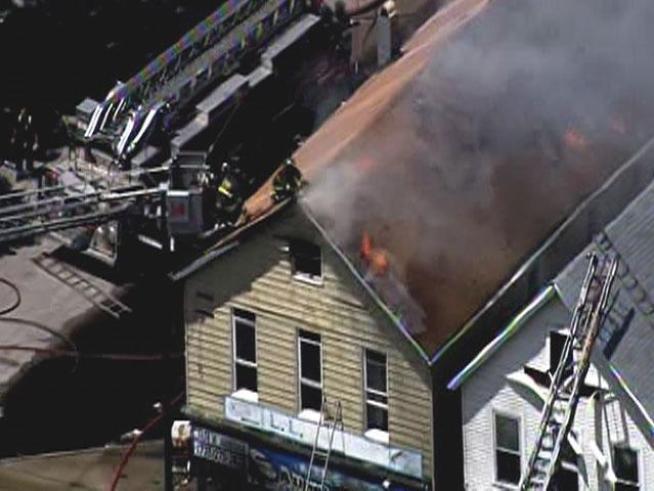 At least two buildings with commercial space on the ground floor and residences above went up in flames in the 3400 block of West Armitage Avenue.