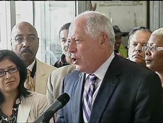 Governor had to shout over throngs of protesters not happy with the amount of money the state has invested in black communities.