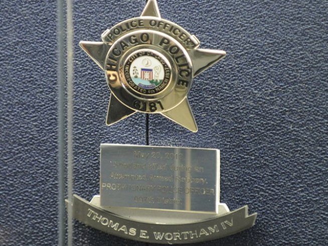 As his police star is retired, the parents of slain <a title=
