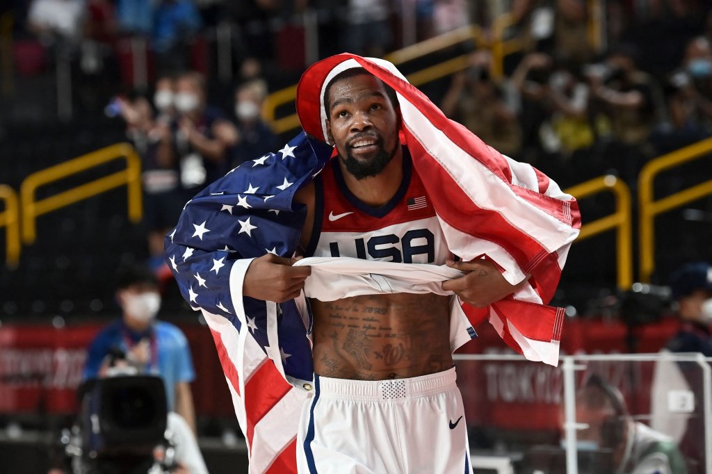 Kevin Durant has the US flag around him