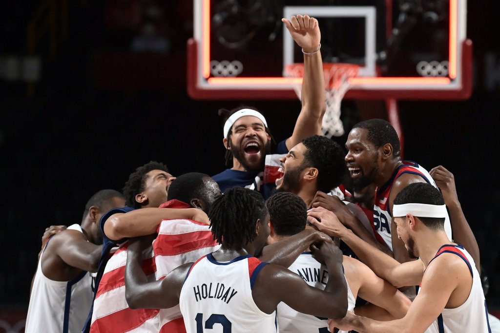 USA's players celebrate their victory at the end of the men's final basketball match between France and USA during the Tokyo 2020 Olympic Games at the Saitama Super Arena in Saitama, Japan on Aug. 7, 2021.