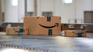 AMAZON packages on a conveyor belt