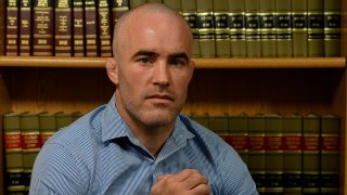 Wrestler Andy Hrovat sits in his attorney's office in Denver on Feb. 20, 2020, for an interview about his experience with a former University of Michigan doctor accused by several former students of sexual abuse.