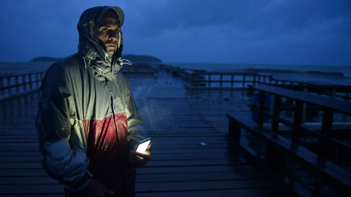 David Cruz Marrero watches the waves at Punta Santiago pier hours before the imminent impact of Hurricane Maria Tuesday, Sept. 19, 2017.