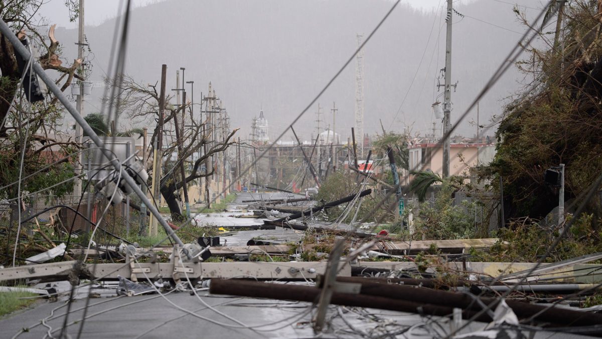 Electricity poles and lines lay toppled on the road after Hurricane Maria hit the eastern region of the island, in Humacao, Puerto Rico, Wednesday, Sept. 20, 2017. The strongest hurricane to hit Puerto Rico in more than 80 years destroyed hundreds of homes, knocked out power across the entire island and turned some streets into raging rivers in an onslaught that could plunge the U.S. territory deeper into financial crisis.