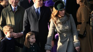 Britain's Prince William, Duke of Cambridge and Catherine, Duchess of Cambridge stand with their children Prince George and Princess Charlotte after attending a Christmas day service at the St Mary Magdalene Church in Sandringham in Norfolk, England, Wednesday, Dec. 25, 2019.