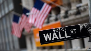 This Jan. 31, 2020, file photo shows a Wall Street sign in front of the New York Stock Exchange.