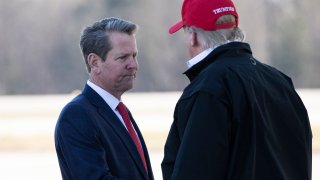 Gov. Brian Kemp, R-Ga., greets President Donald Trump as he steps off Air Force One during arrival, Friday, March 6, 2020, at Dobbins Air Reserve Base in Marietta, Ga.