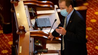 Illinois State Sen. Paul Schimpf, R-Waterloo, asks questions of Illinois State Sen. Julie Morrison, D-Deerfield, during debate on SB1863, a bill dealing with vote by mail and other changes for the 2020 election, on the floor of the Illinois Senate during session at the Illinois State Capitol, Friday, May 22, 2020, in Springfield, Ill.