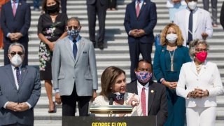 House Speaker Nancy Pelosi of Calif., joined by House Democrats spaced for social distancing, speaks during a news conference on the House East Front Steps on Capitol Hill in Washington, Thursday, June 25, 2020, ahead of the House vote on the George Floyd Justice in Policing Act of 2020.