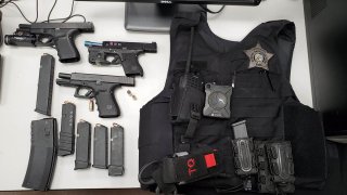 Chicago police display armor-piercing bullets and a bulletproof vest found during a traffic stop February 23 in Chicago