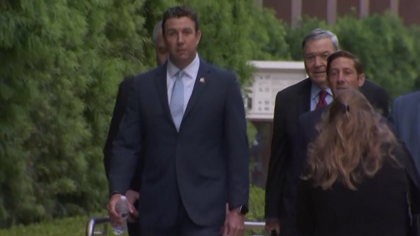 Ex-Congressman Duncan Hunter walks into court for sentencing
