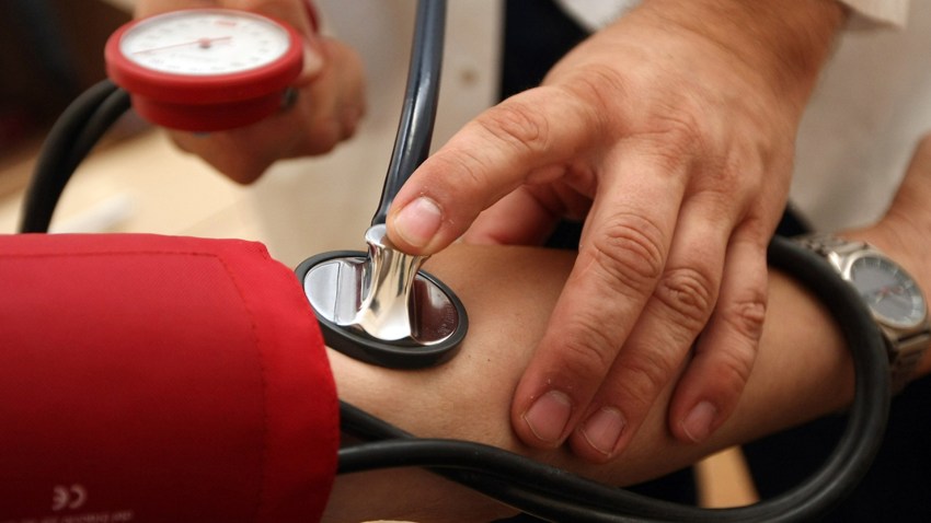In this file photo, a doctor checks a patient's blood pressure on September 5, 2012 in Berlin, Germany.