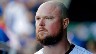 CHICAGO, IL – SEPTEMBER 15: Jon Lester #34 of the Chicago Cubs looks on while walking in the dugout after pitching against the Cincinnati Reds during the seventh inning at Wrigley Field on September 15, 2018 in Chicago, Illinois. (Photo by Jon Durr/Getty Images)