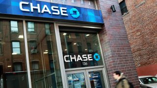 A man enters a JP Morgan Chase branch bank