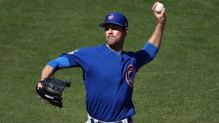 Cole Hamels delivers a pitch during a spring training game between the Boston Red Sox and Chicago Cubs.