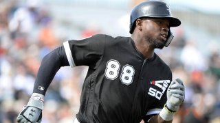 White Sox outfielder Luis Robert rounds the bases after getting a base hit in spring training action
