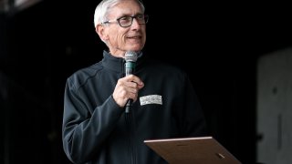 Wisconsin Gov. Tony Evers speaks to the crowd during the 48th Annual Juneteenth Day Festival on June 19, 2019, in Milwaukee.