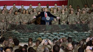Donald Trump speaks to the troops during a surprise Thanksgiving day visit at Bagram Air Field in Afghanistan