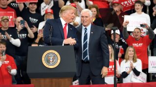 President Donald Trump shares the stage with Vice President Mike Pence at the Giant Center, in Hershey, Pa., on Dec. 10, 2019.