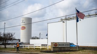 A worker walks past the Tyson Foods Inc. processing plant in Center, Texas