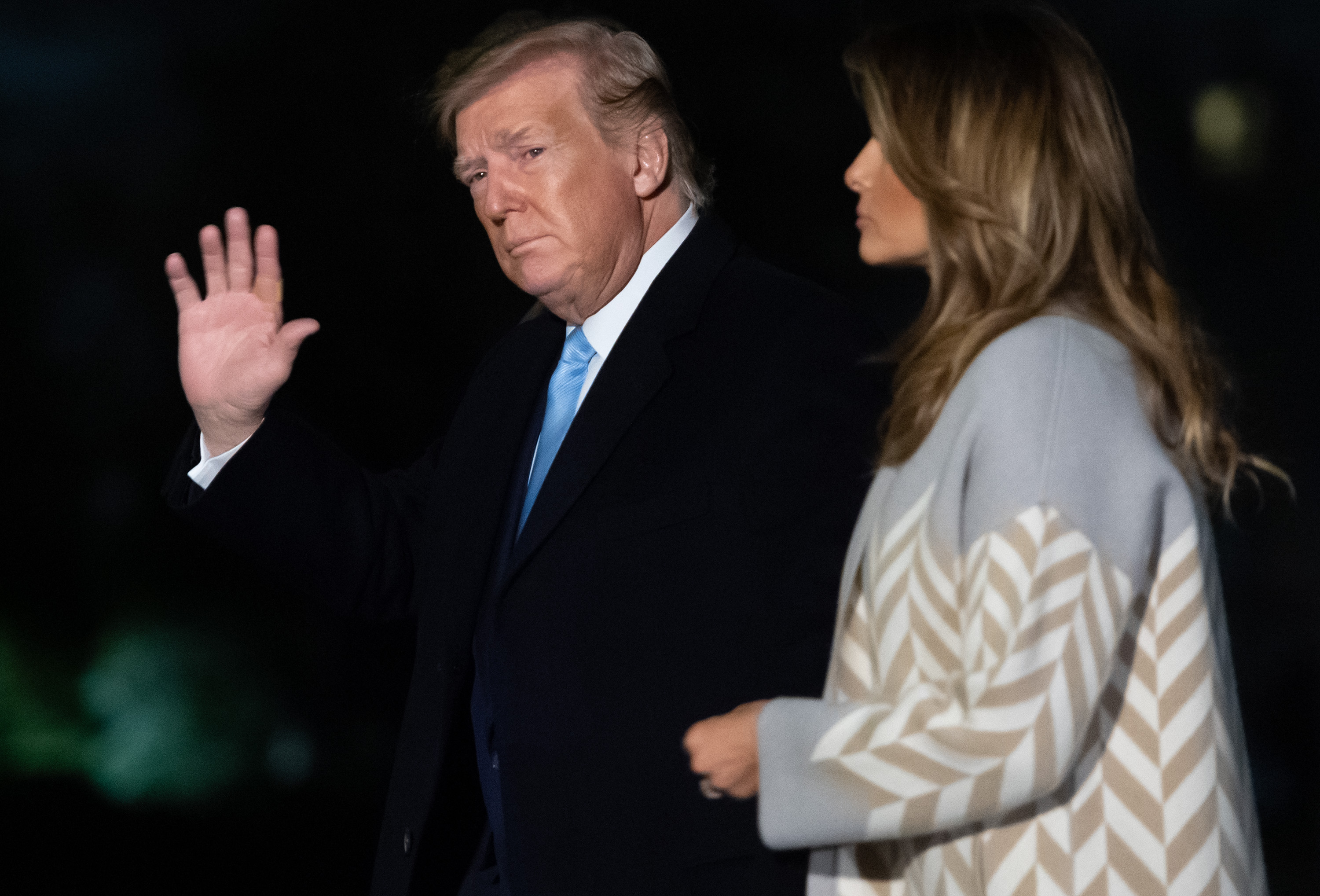 President Donald Trump and First Lady Melania Trump walk across the South Lawn after arriving on Marine One at the White House in Washington, Jan. 5, 2020, as they return following a trip to Mar-a-Lago in West Palm Beach, Florida, for the holidays.