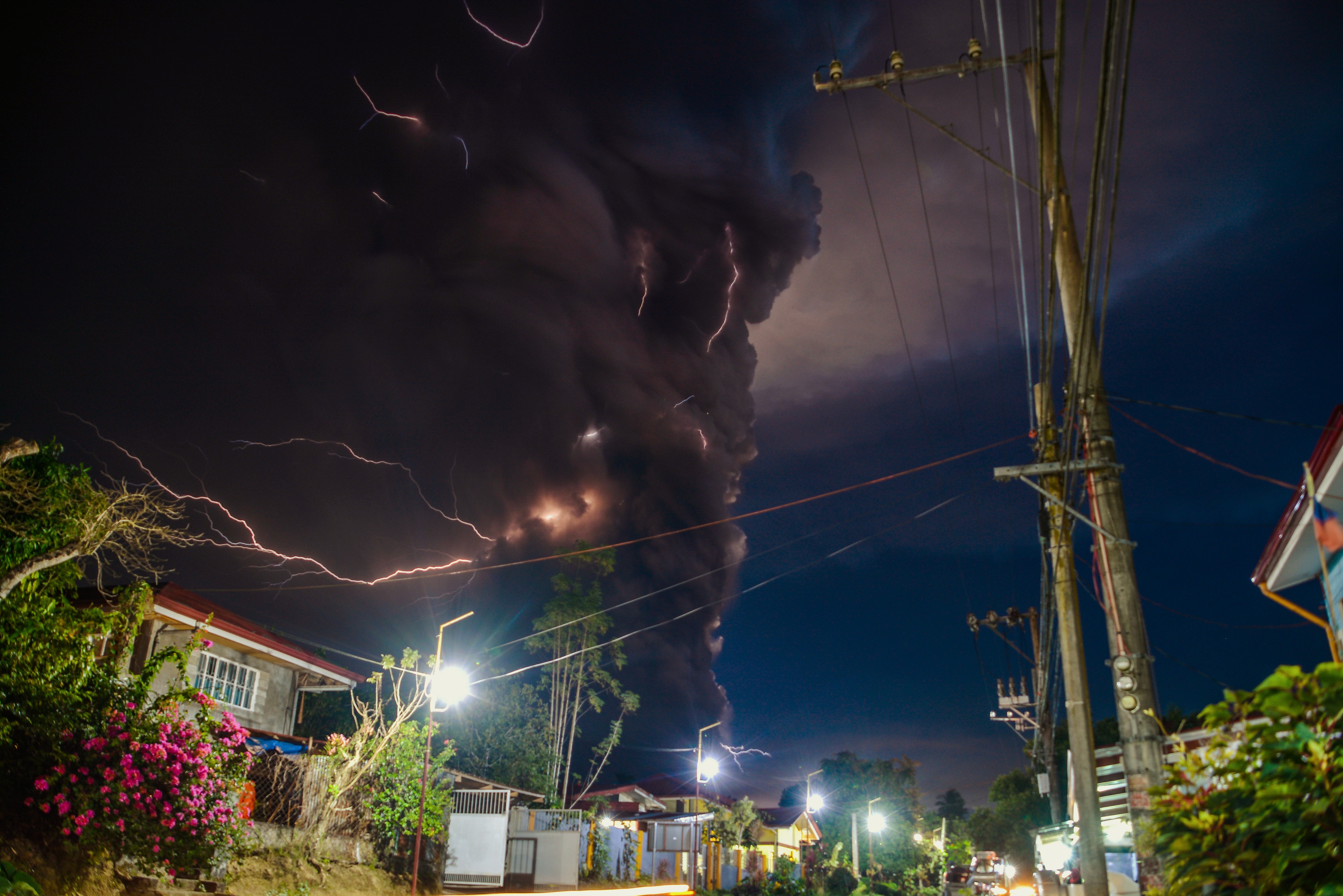 The Taal volcano booms to life, Sunday, Jan. 12, 2020, spilling a thick blanket of volcanic ash over nearby towns and cities just south of the capital of Manila.