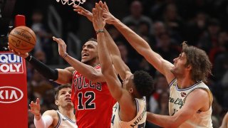 CHICAGO, ILLINOIS – DECEMBER 30: Daniel Gafford #12 of the Chicago Bulls puts up a shot against (L-R) Kyle Korver #26, Giannis Antetokounmpo #34 and Robin Lopez #42 of the Milwaukee Bucks at the United Center on December 30, 2019 in Chicago, Illinois. The Bucks defeated the Bulls 123-102. NOTE TO USER: User expressly acknowledges and agrees that , by downloading and or using this photograph, User is consenting to the terms and conditions of the Getty Images License Agreement. (Photo by Jonathan Daniel/Getty Images)