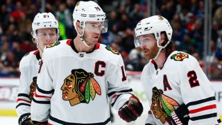 VANCOUVER, BC – JANUARY 2: Jonathan Toews #19 of the Chicago Blackhawks talks to teammate Duncan Keith #2 during their NHL game against the Vancouver Canucks at Rogers Arena January 2, 2020 in Vancouver, British Columbia, Canada. (Photo by Jeff Vinnick/NHLI via Getty Images)”n