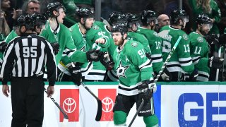 Tyler Seguin celebrates after scoring a goal against the Blackhawks on February 23