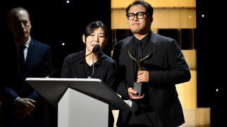 Han Jin-won accepts the award for outstanding original screenplay for “Parasite” onstage during the 2020 Writers Guild Awards ceremony at The Beverly Hilton Hotel on Feb. 1, 2020, in Beverly Hills, California.