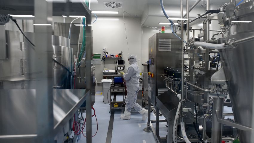 An employee wearing protective equipment works at the production line of Russia's biotech company BIOCAD, which is developing its own vaccine against the new coronavirus and working on another one in cooperation with the country's virus research centre in Siberia, Vektor, in Strelna on May 20, 2020.