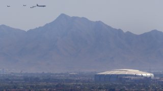 Luke AFB's 56th Fighter Wing and the 944th Fighter Wing and Arizona National Guard's 161st Air Refueling Wing fly over State Farm Stadium on May 1, 2020 in Glendale, Arizona.