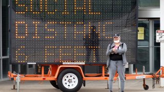 Workers leave Ford's Chicago Assembly Plant on May 20