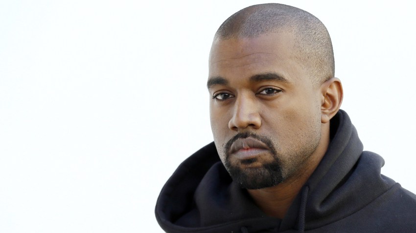 In this March 6, 2015, file photo, Kanye West poses before Christian Dior 2015-2016 fall/winter ready-to-wear collection fashion show in Paris.