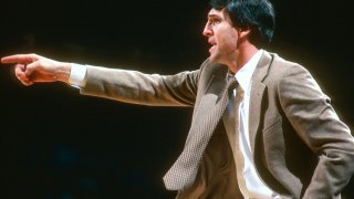 Head coach Jerry Sloan of the Chicago Bulls looks on from the sidelines against the Washington Bullets during an NBA basketball game circa 1981