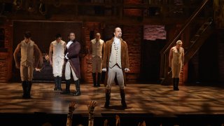 Actor Leslie Odom, Jr. (L) and actor, composer Lin-Manuel Miranda (R) perform on stage during "Hamilton"