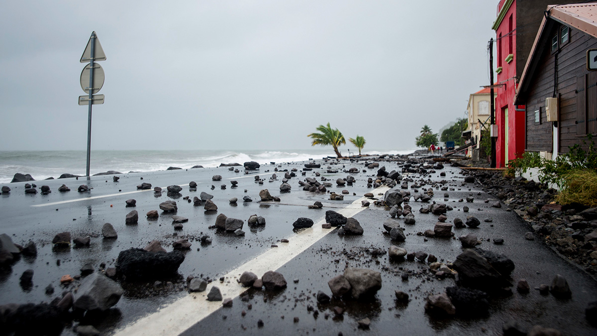 A picture shows rocks swept by strong waves onto a road in Le Carbet, on the French Caribbean island of Martinique, after it was hit by Hurricane Maria, on September 19, 2017.