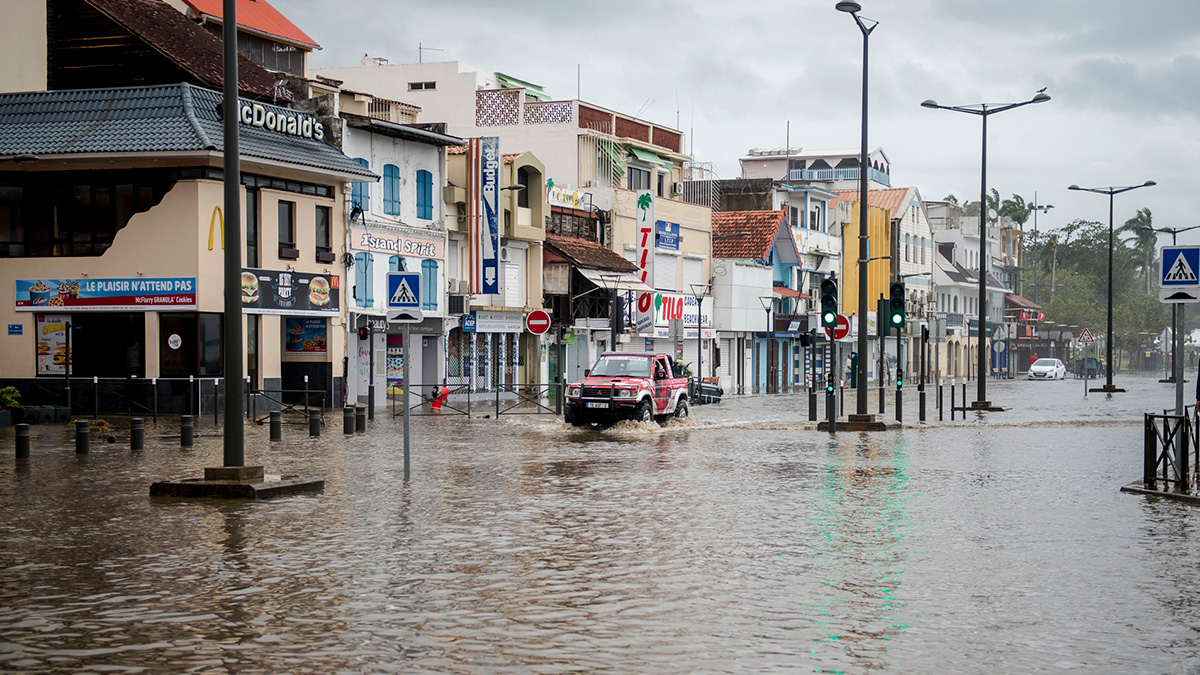 A motorist drives on the flooded waterfront in Fort-de-France, on the French Caribbean island of Martinique, after it was hit by Hurricane Maria, on September 19, 2017.