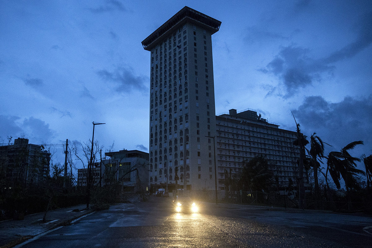 Buildings are completely dark during a total blackout after Hurricane Maria made landfall Sept. 20, 2017, in San Juan, Puerto Rico. Thousands of people have sought refuge in shelters, and electricity and phone lines have been severely effected.