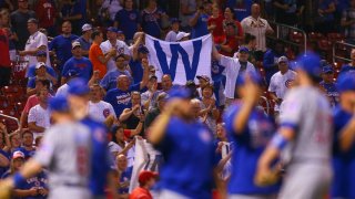 GettyImages-853876346 chicago cubs cardinals fans w flag