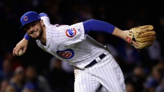 Kris Bryant fields a ball during the National League Championship Series at Wrigley Field