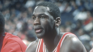 In this file photo, Michael Jordan #23 of the Chicago Bulls looks on from the bench against the Washington Bullets during an NBA basketball game circa 1985 at the Capital Centre in Landover, Maryland.