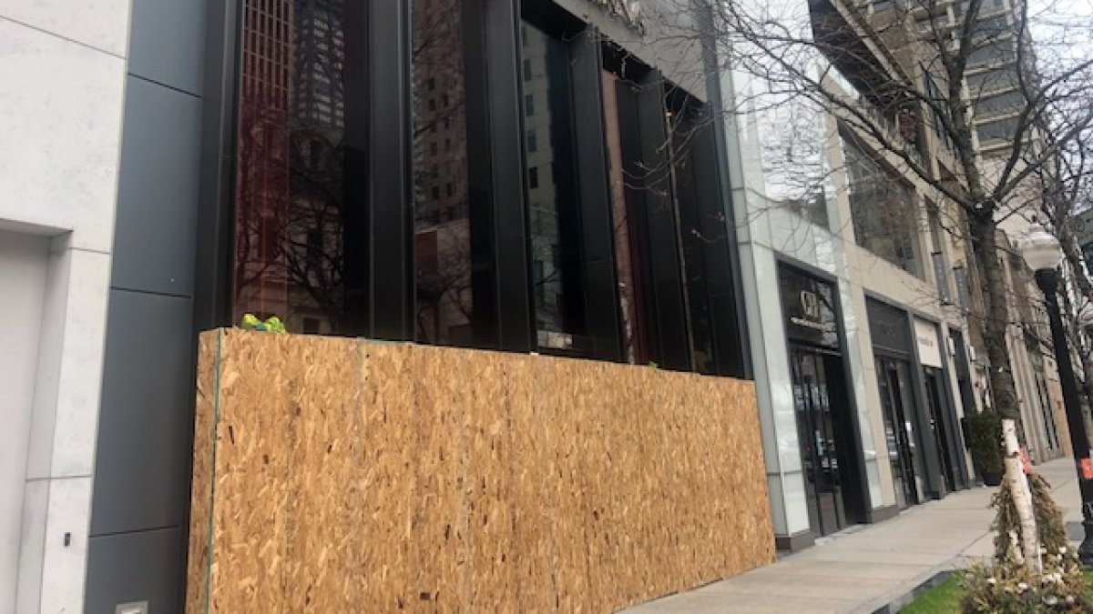 Empty windows, boarded-up storefronts dot the Magnificent Mile during  coronavirus shutdown